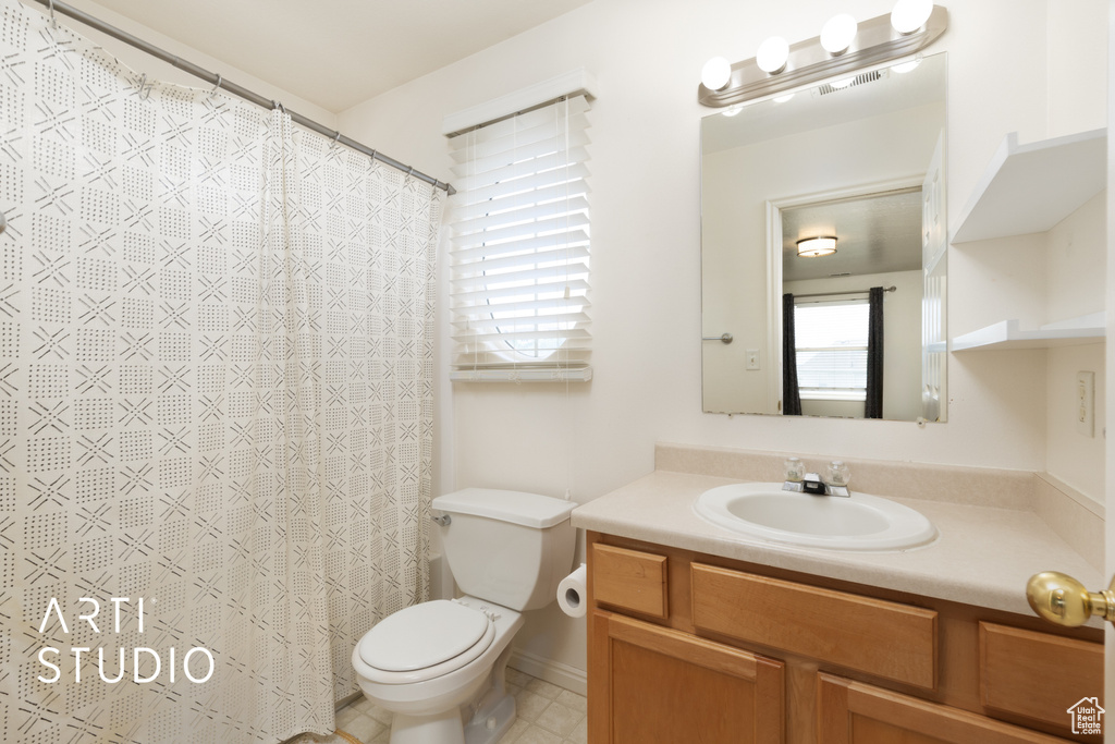 Bathroom with vanity and a shower with shower curtain