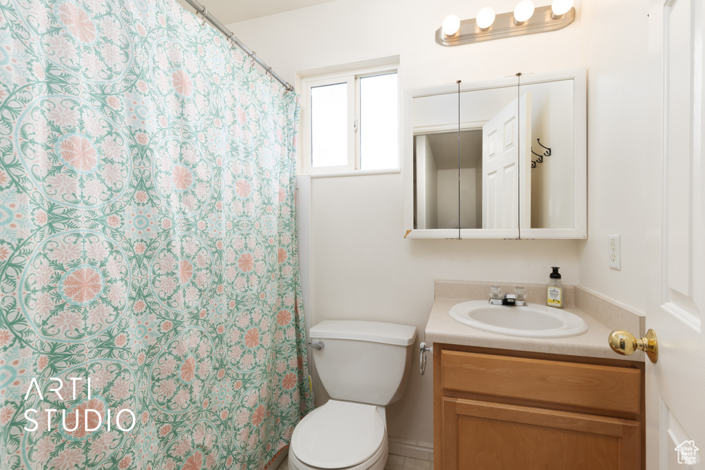 Bathroom featuring vanity and a shower with shower curtain