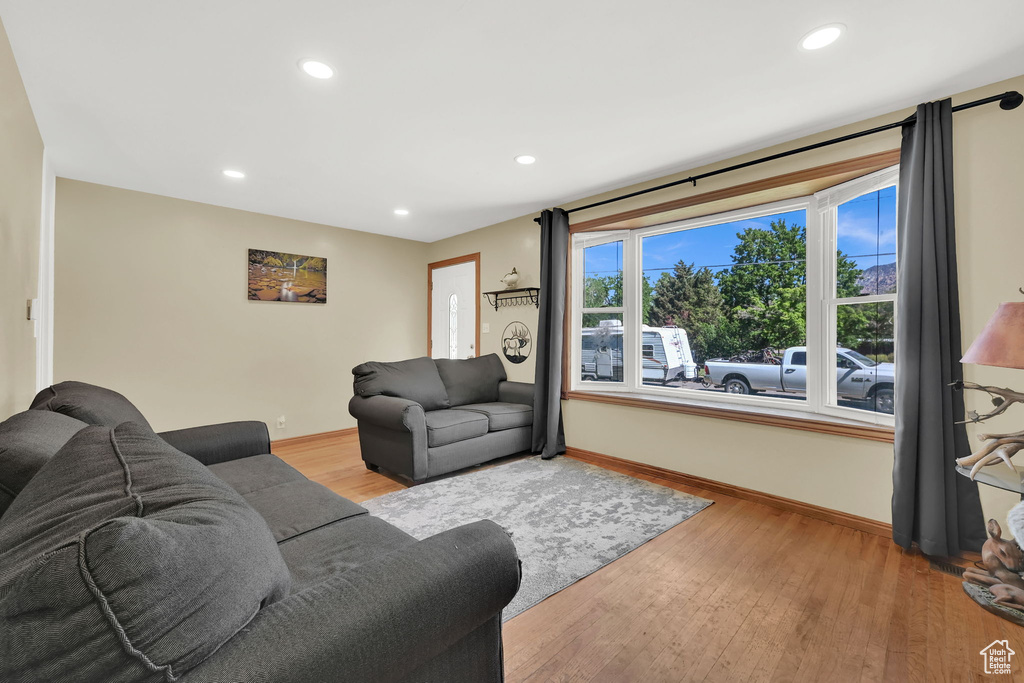 Living area with recessed lighting and wood finished floors