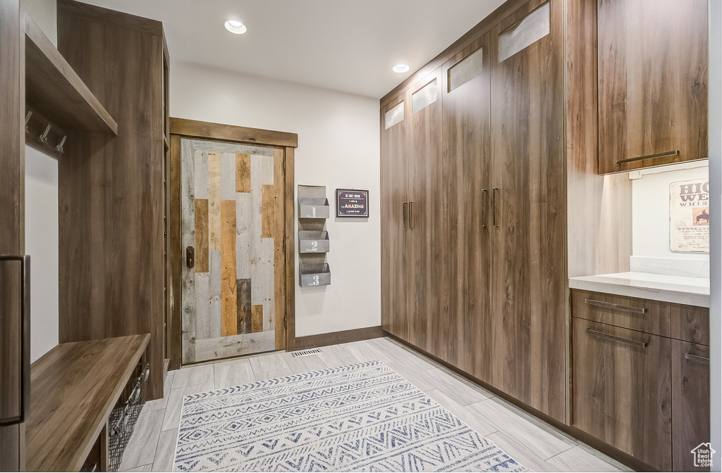 Mudroom with recessed lighting