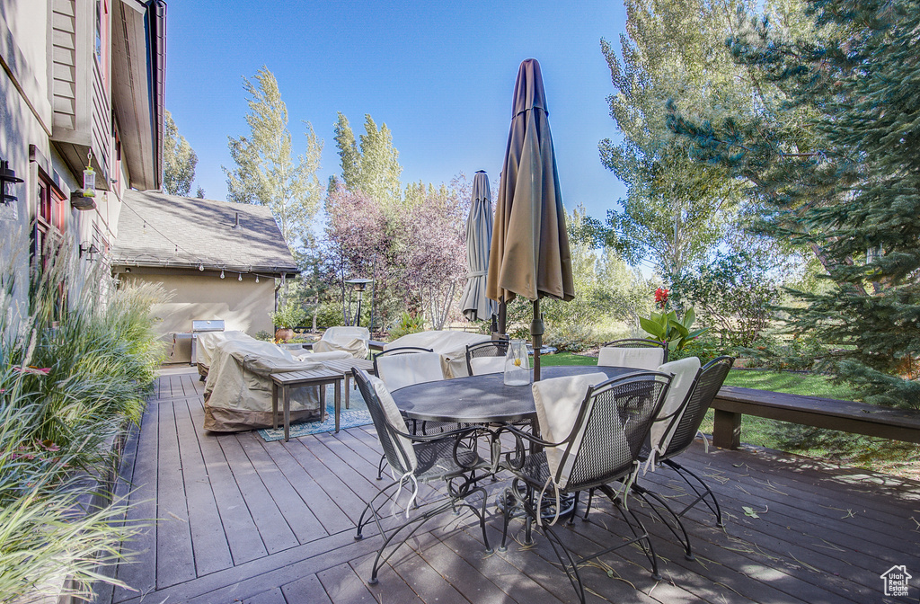 Wooden terrace with outdoor dining area