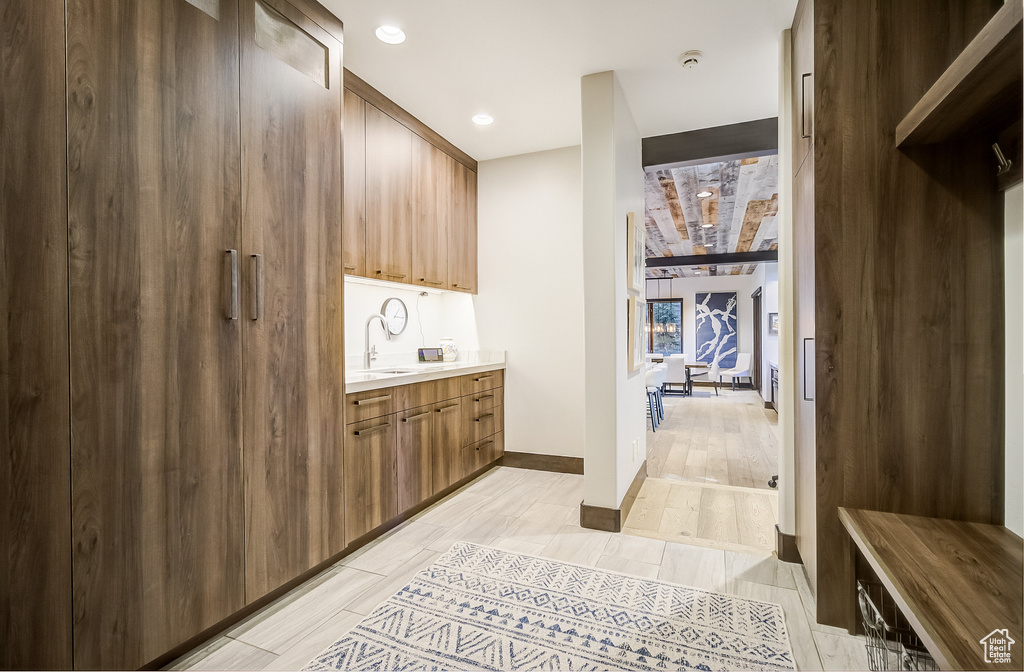 Washroom with a sink and recessed lighting