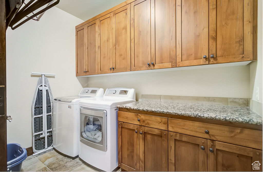 Washroom with cabinet space and separate washer and dryer