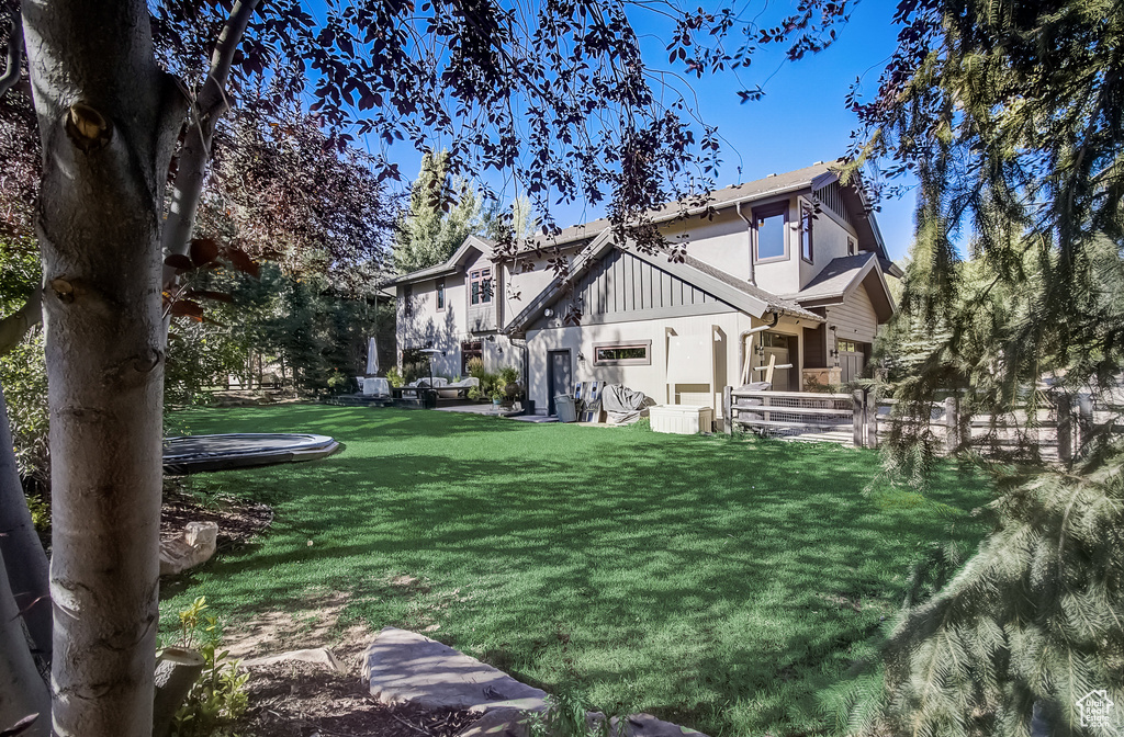 Rear view of property featuring stucco siding