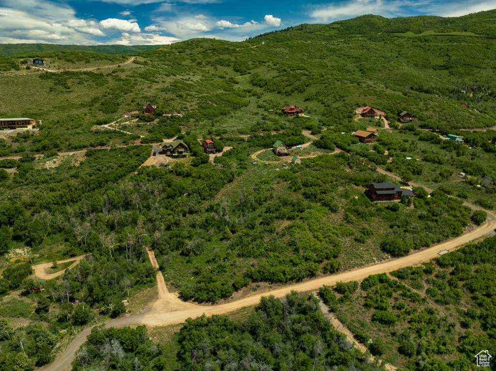 Aerial view of property's location featuring a mountain backdrop