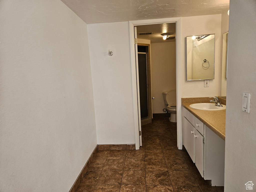 Bathroom with vanity and a stall shower