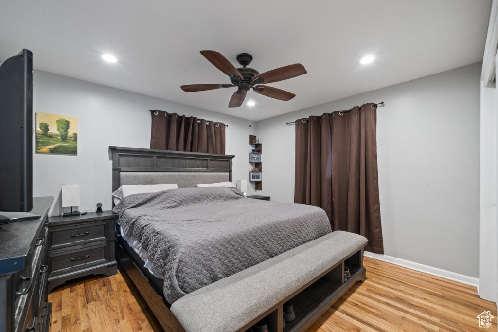 Bedroom with light wood-type flooring, recessed lighting, and ceiling fan
