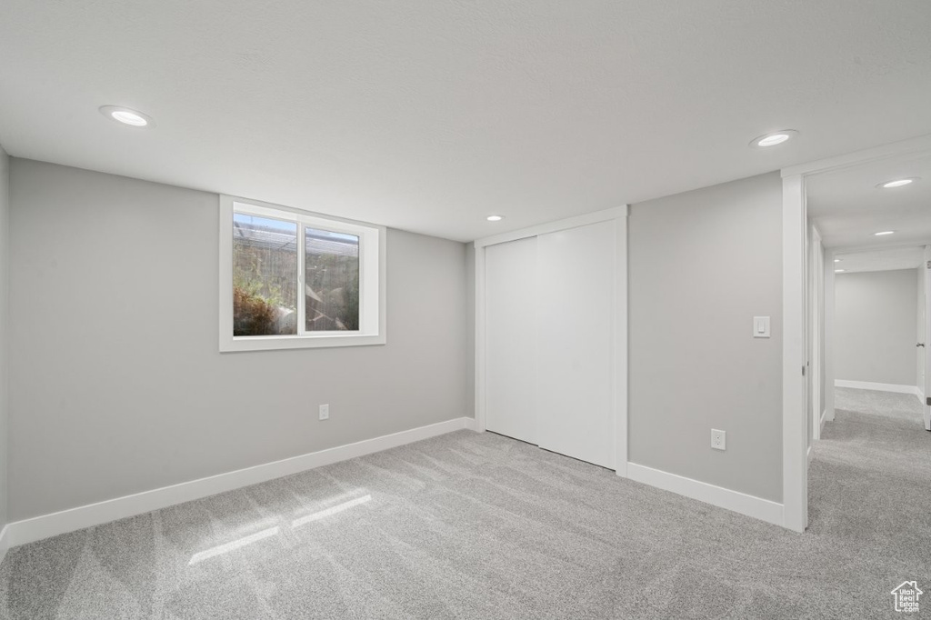 Basement featuring carpet and recessed lighting