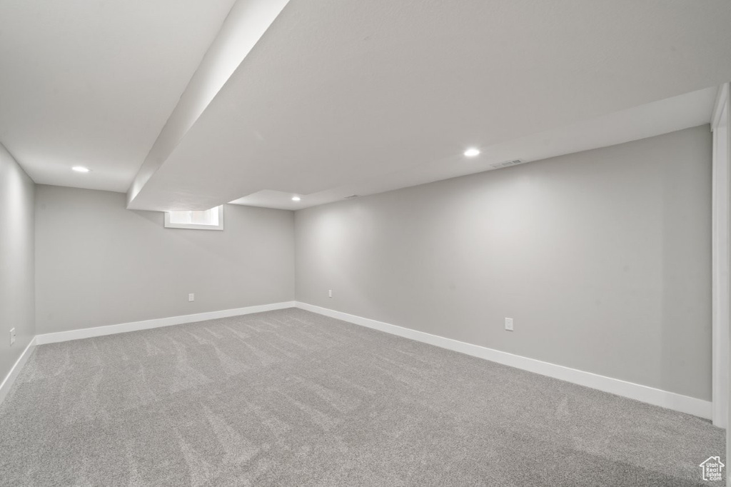 Finished basement with recessed lighting and carpet floors