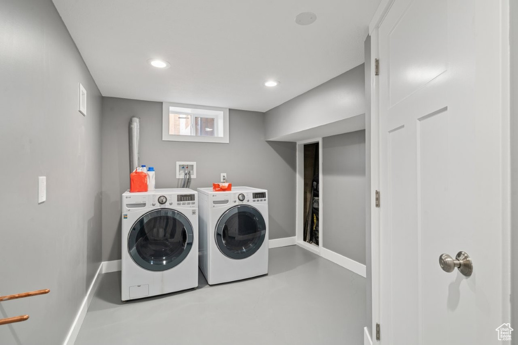 Laundry room featuring washer and dryer and recessed lighting