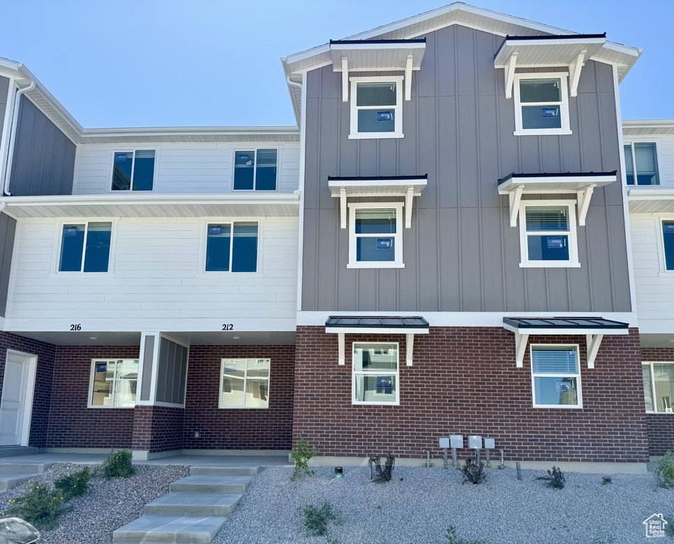 View of front facade with board and batten siding