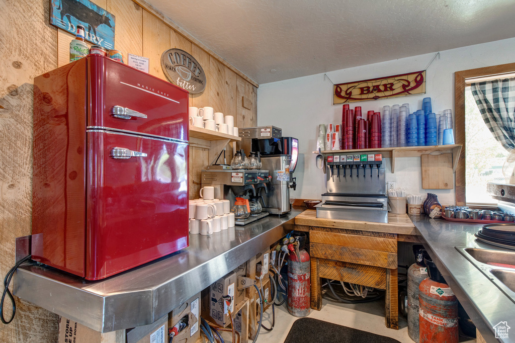 Kitchen with stainless steel countertops and open shelves
