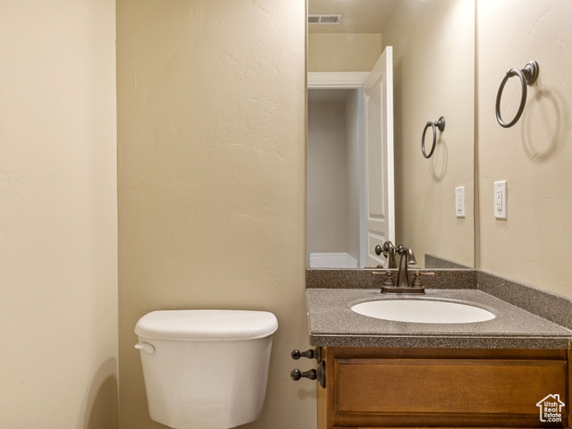 Half bath with toilet and vanity
