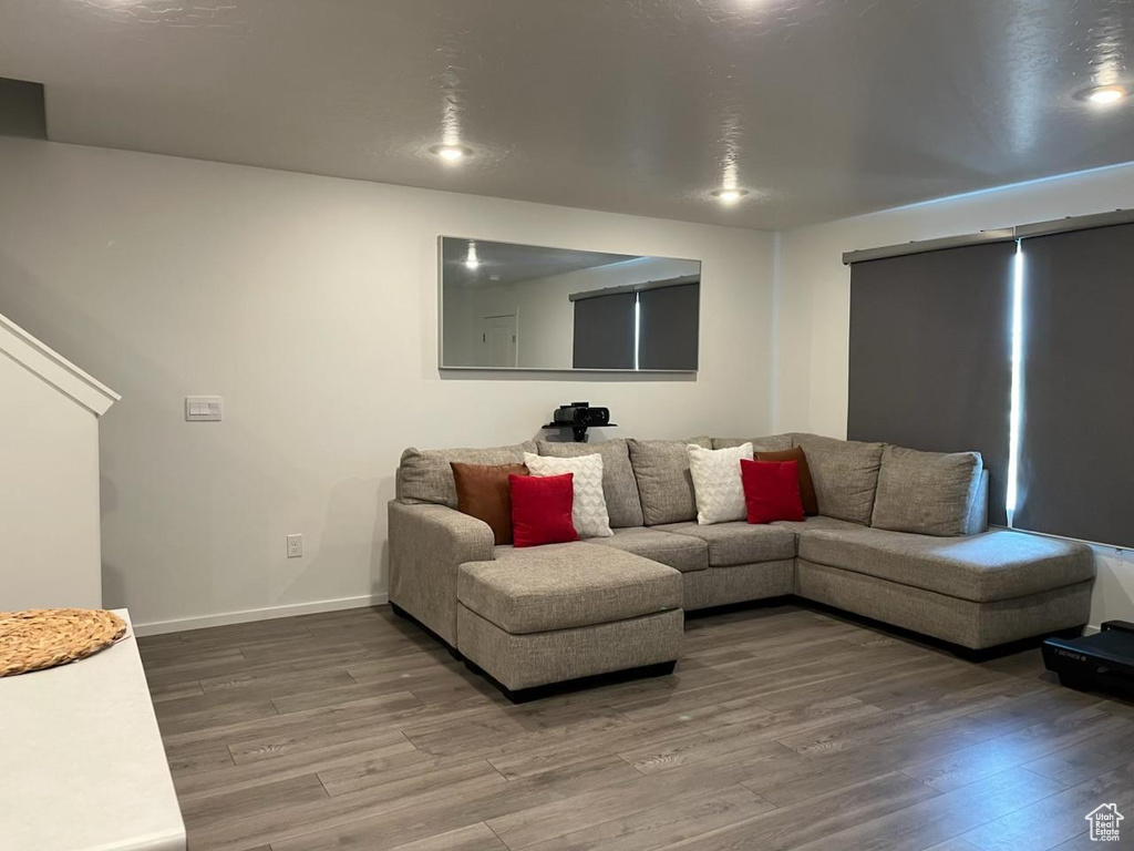 Living area featuring light wood-style flooring and baseboards