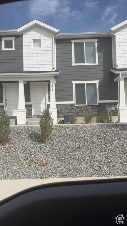 Craftsman-style house featuring stone siding