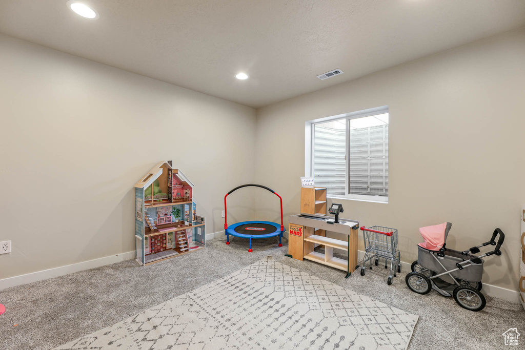 Game room with carpet flooring and recessed lighting