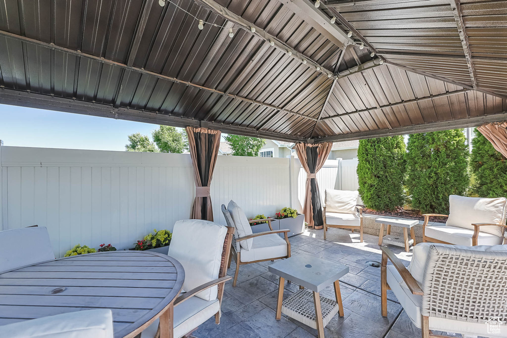 View of patio featuring a gazebo