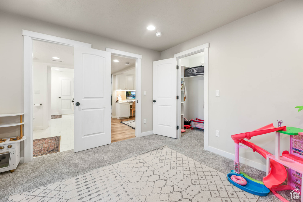 Game room with carpet flooring and recessed lighting