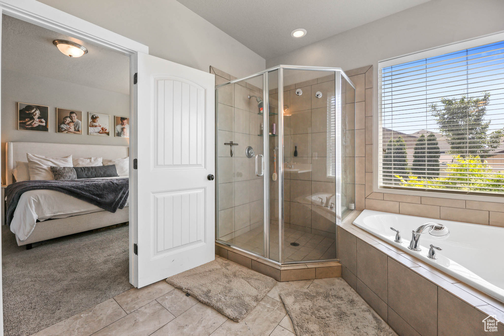 Ensuite bathroom with a garden tub and a shower stall