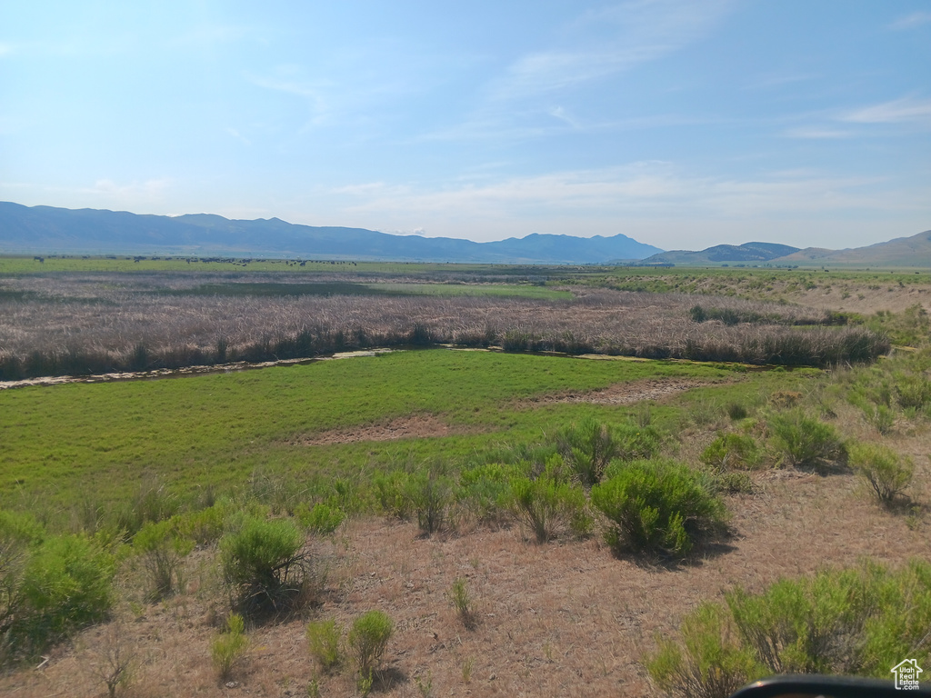 View of mountain backdrop featuring rural landscape