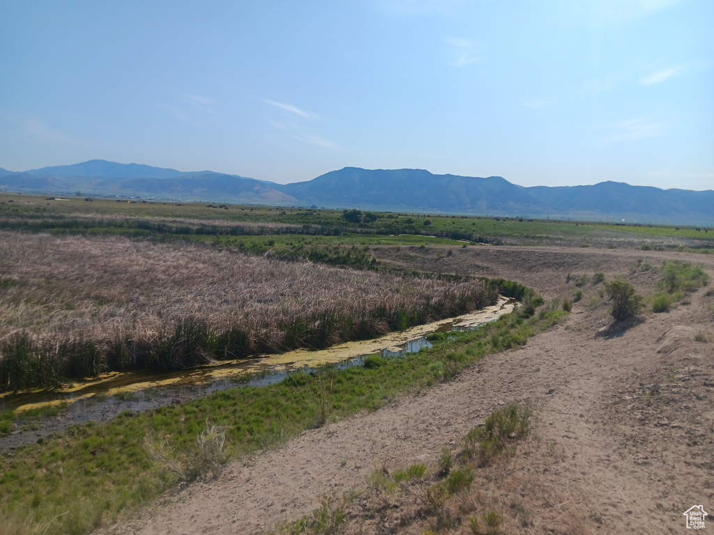 View of mountain background featuring rural landscape