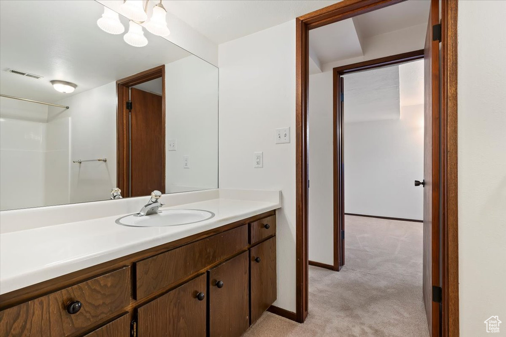 Bathroom with vanity and baseboards