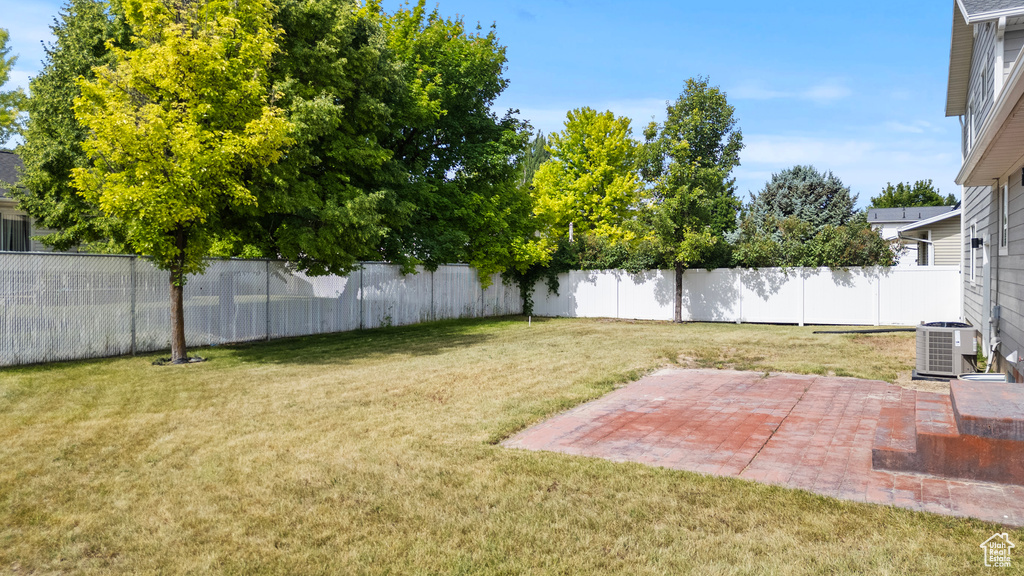 Fenced backyard featuring a patio area