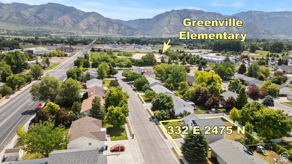 Aerial view of residential area with a mountain backdrop