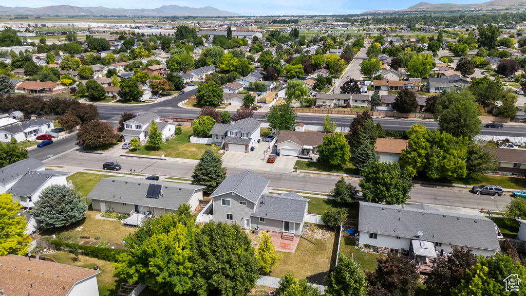 Aerial view of residential area featuring mountains