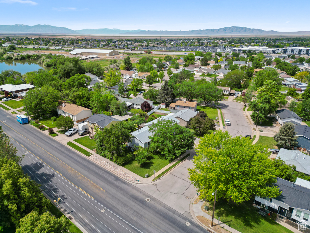 Aerial perspective of suburban area with a mountainous background