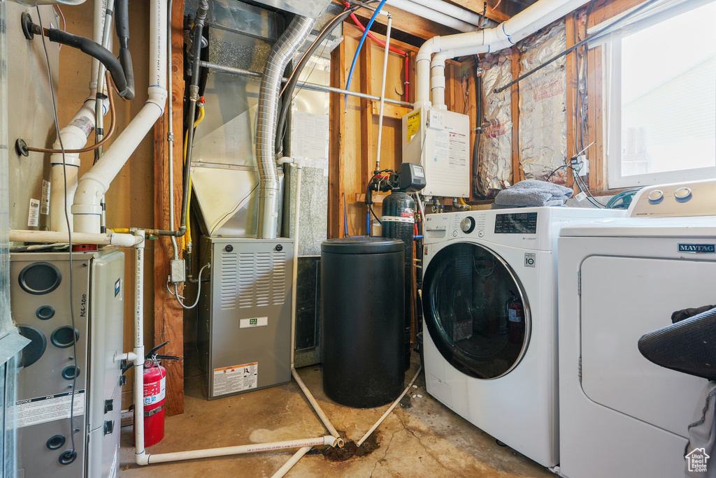 Laundry area with independent washer and dryer and heating unit