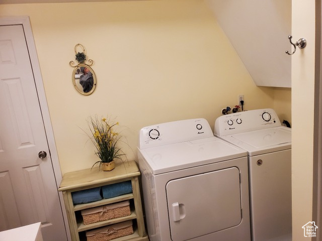 Laundry room featuring separate washer and dryer