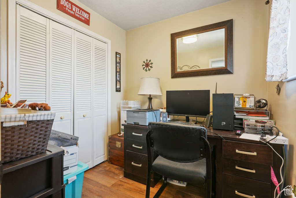 Office area featuring wood finished floors
