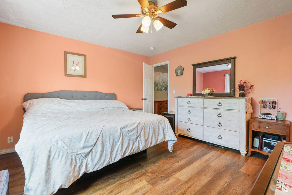 Bedroom featuring wood finished floors and ceiling fan