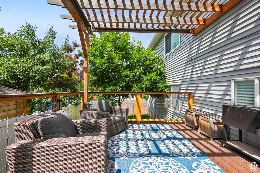 Wooden terrace featuring a pergola