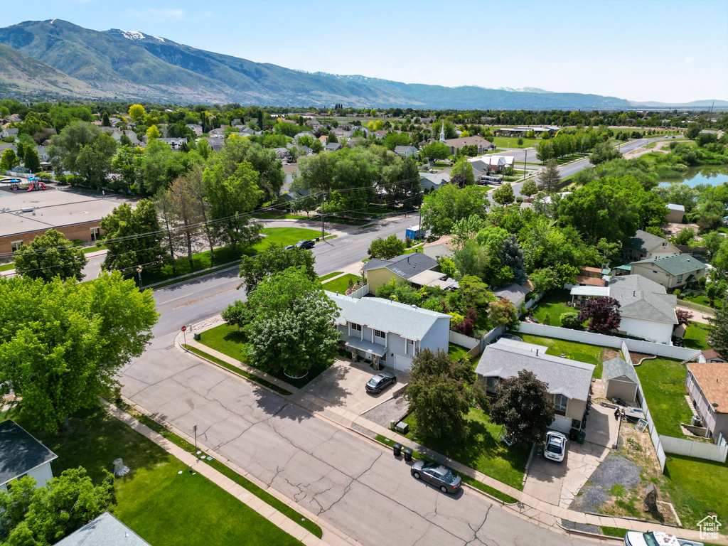 Aerial view of residential area featuring a mountain backdrop