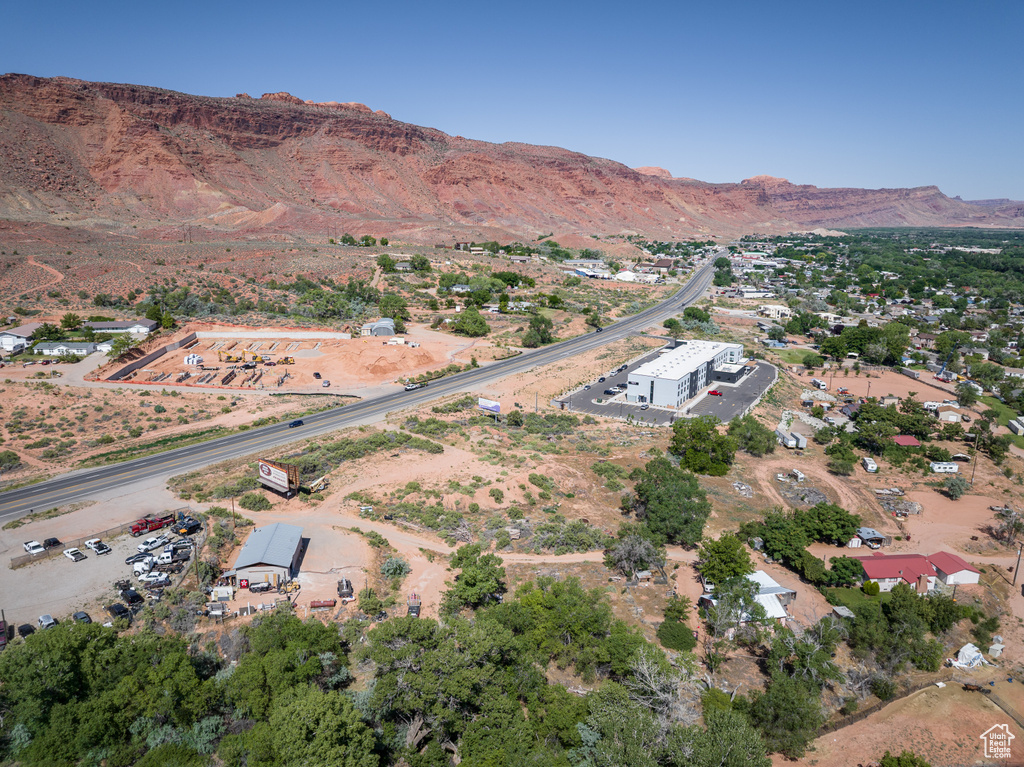 Aerial view of property and surrounding area with mountains