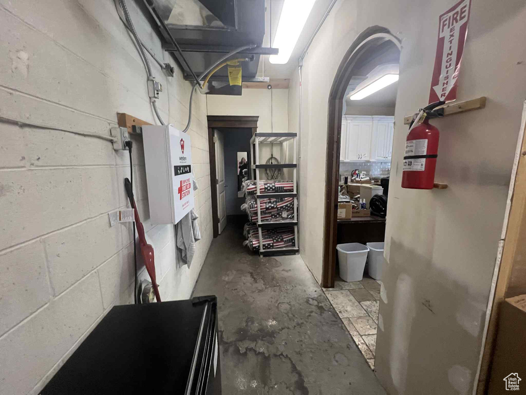 Basement featuring concrete block wall