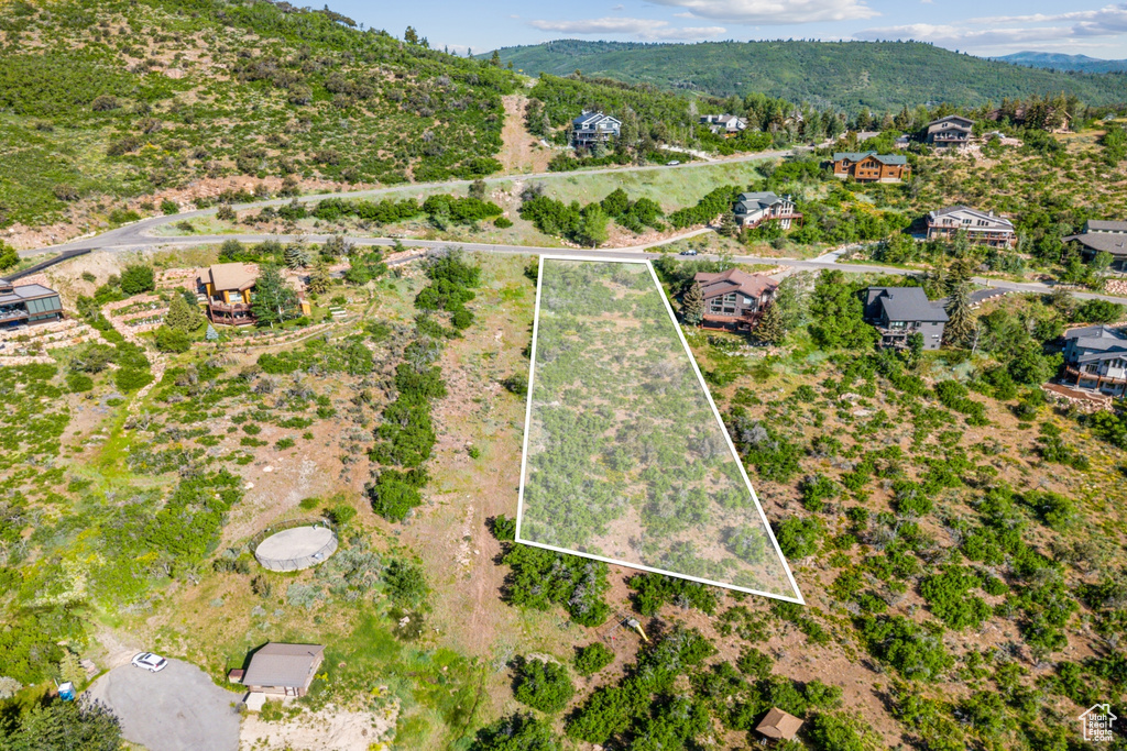 View of property location with a mountain backdrop and property parcel outlined
