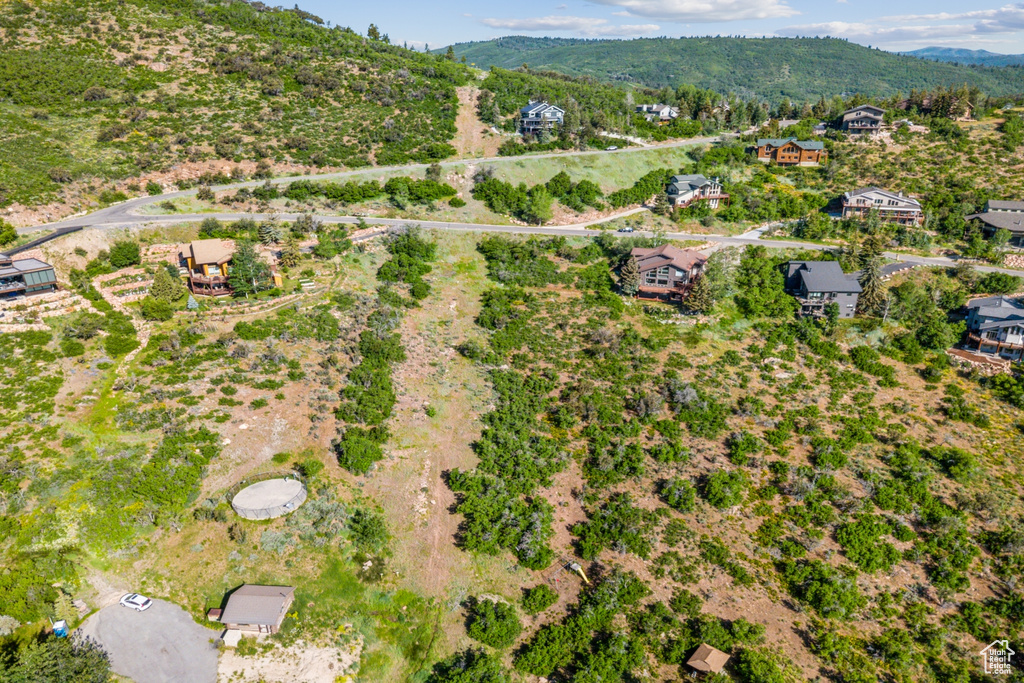 Aerial overview of property's location with a mountainous background