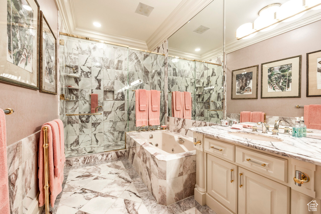 Bathroom with a marble finish shower, crown molding, a whirlpool tub, vanity, and marble finish flooring