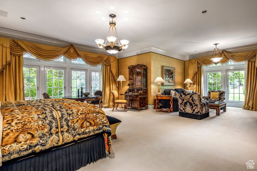 Bedroom featuring access to outside, carpet, a chandelier, and ornamental molding