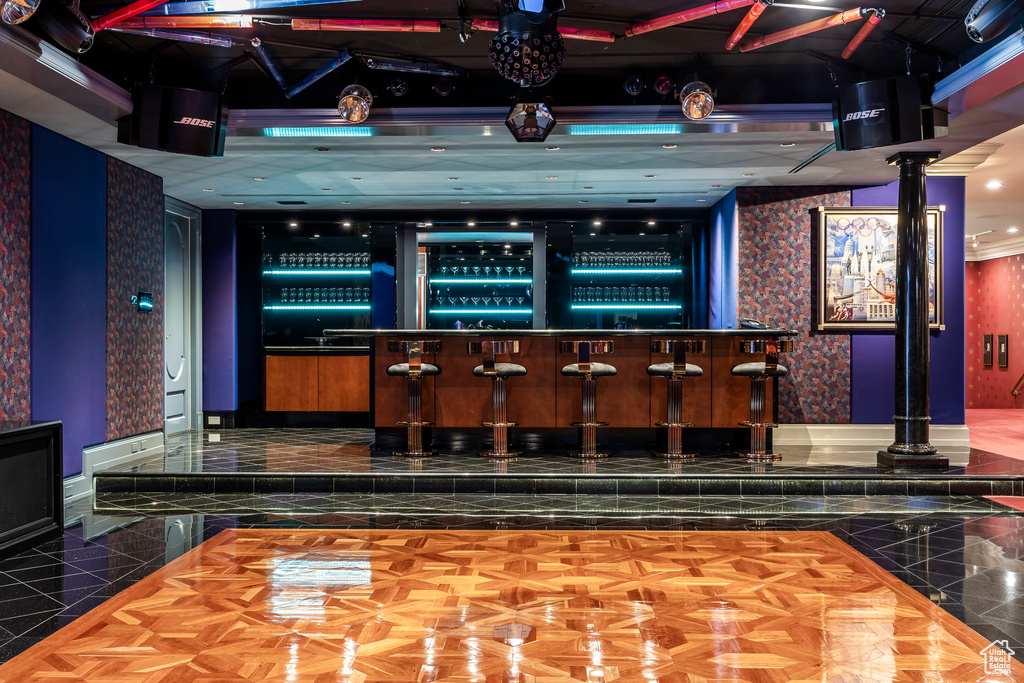 Bar area with ornate columns and baseboards
