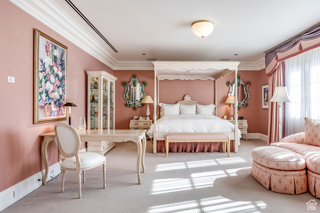 Carpeted bedroom with ornamental molding and baseboards