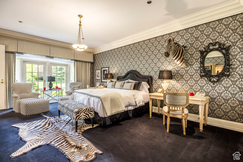 Carpeted bedroom with ornamental molding, wallpapered walls, and access to outside
