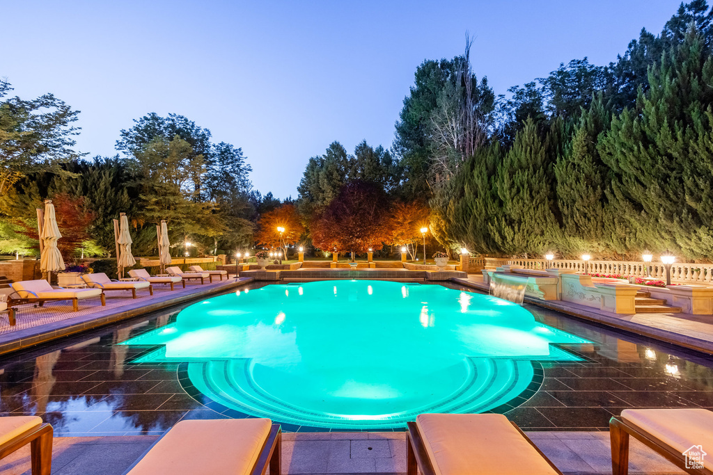 Outdoor pool featuring a patio