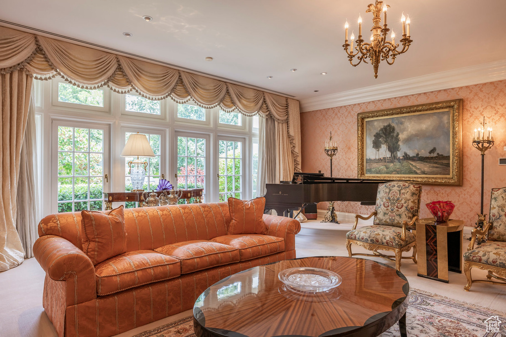 Living area with wallpapered walls, ornamental molding, and a chandelier