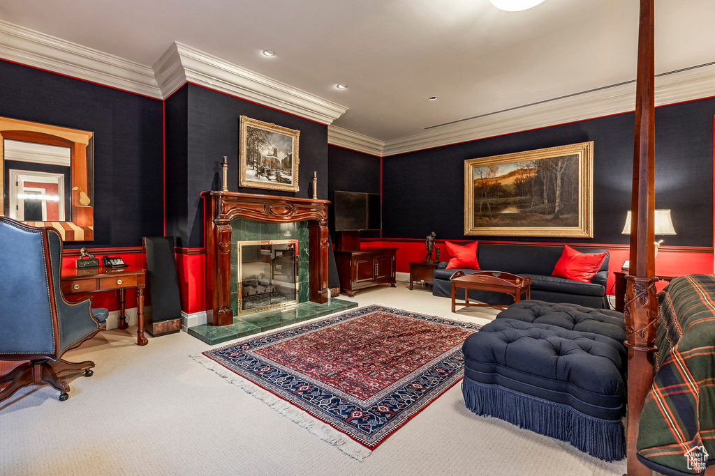 Living room with carpet floors and ornamental molding