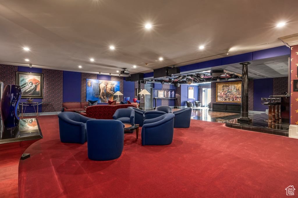 Carpeted home theater with recessed lighting, wallpapered walls, and a dry bar