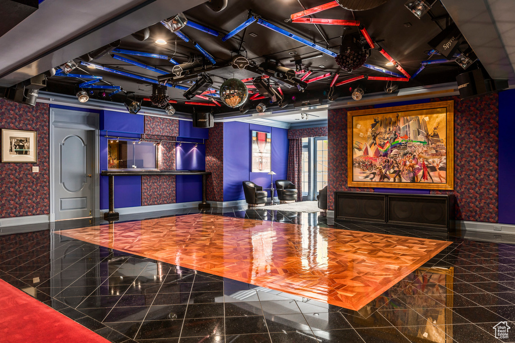 Rec room with granite tiled floors and wallpapered walls